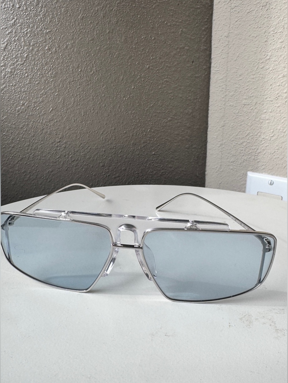 Prada Silver Frame Sunglasses with Light Blue Lenses unisex